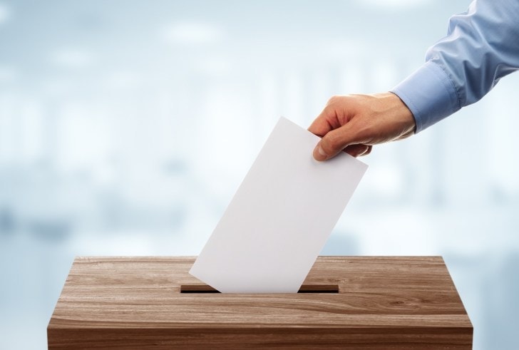 bigstock-ballot-box-with-person-casting-107447402-e1518101056311.jpg
