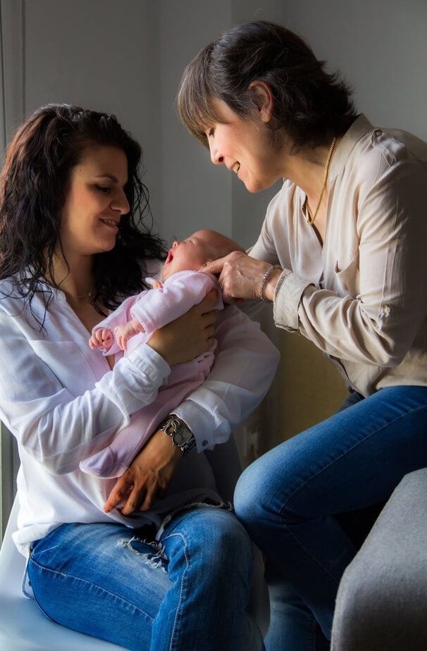tender family moment with newborn baby