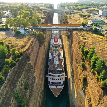 img3-450x450 Luxury cruise ship navigating through Corinth Canal in Greece, surrounded by lush greenery and scenic landscape.