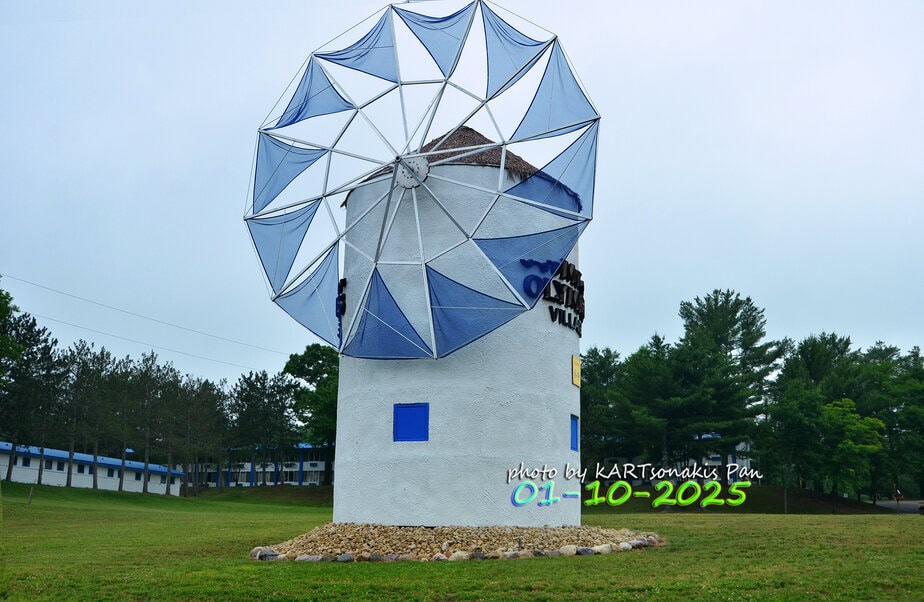 MAIL DSC82112_7575 Colorful windmill sculpture in Corinth, Greece, showcasing local art and culture.